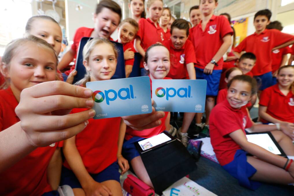 Students show off their school Opal cards at the launch in 2015. Walking distance restrictions mean some students are ineligible. Picture: Peter Rae