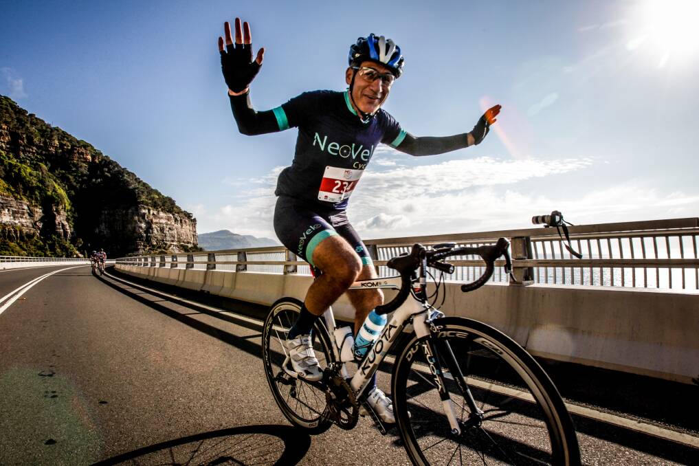 FLASHBACK: A cyclist waves as he rides along the Sea Cliff Bridge during the 2015 MS Sydney To Gong Bike Ride. Picture: Georgia Matts