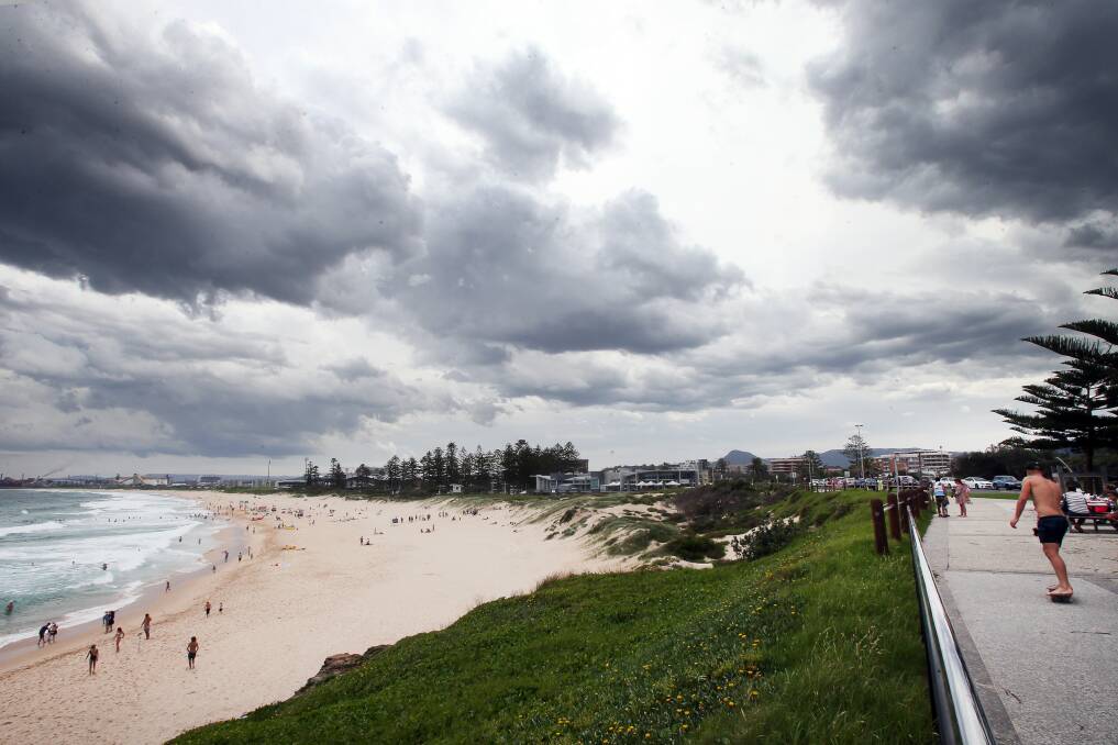 FILE PHOTO: Storm clouds dominate the sky over Wollongong City beach in January. Picture: Sylvia Liber