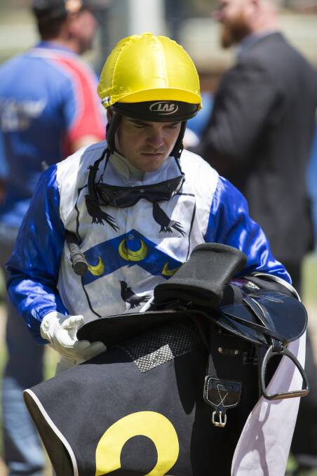 To the untrained eye some might think the lighter the jockey the faster a horse will run, or their silks are just pretty colours. But both, jockey Shaun Guymer says, are actually quite complicated. (Shown here after winning a race at Queanbeyan in 2016). Picture: Ray Vance