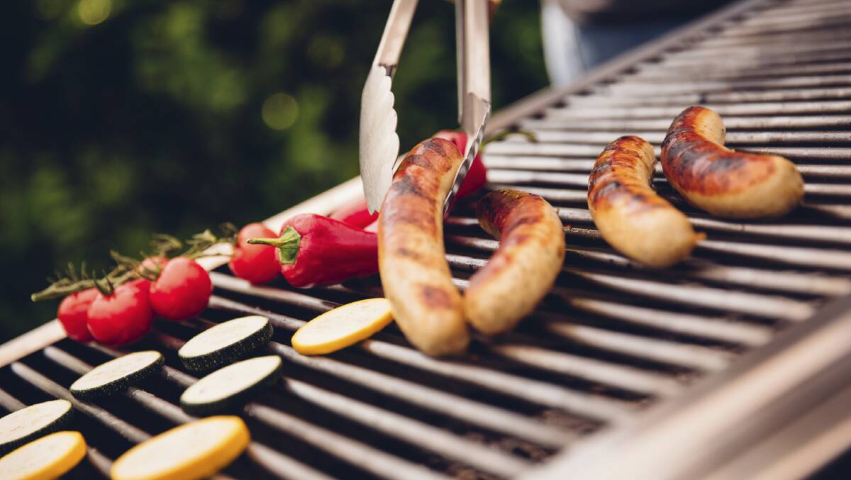 Bratwurst sausages cooking on an outdoor barbecue. Picture: Fairfax File
