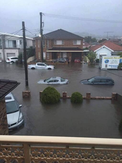 Going under again: This photo shows the extent of flooding on Kembla St near the corner of Swan St on June 5, 2016. Picture: Illawarra SES.