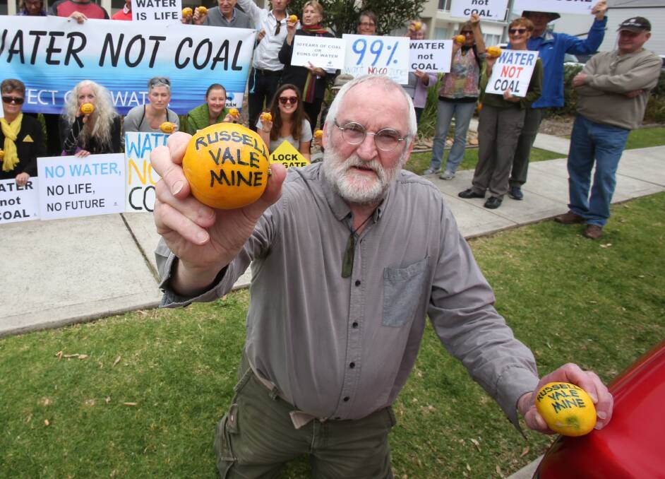 MAKING A STATEMENT: Gavin Workman and Illawarra Residents for Responsible Mining protesters at an earlier AGM of Wollongong Coal in Towradgi.