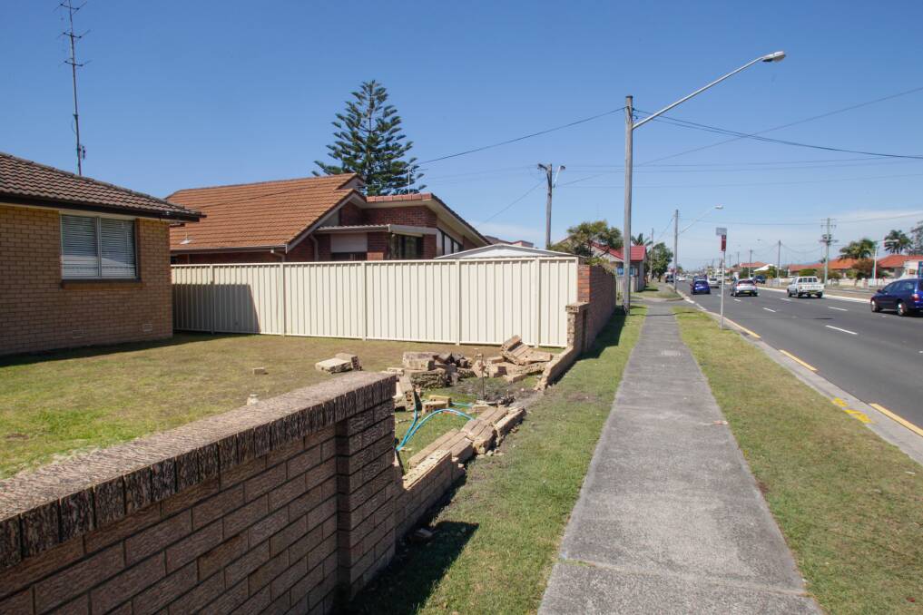 A wall that was damaged after one of a series of accidents on Windang Road in late 2016. Roads and Maritime Services will be lowering the speed limit along part of the road. Picture: Georgia Matts
