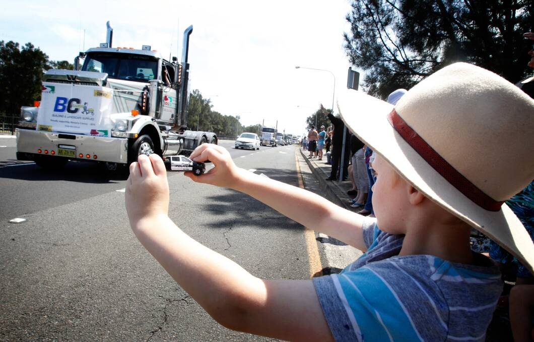 Liam Richardson watching the Illawarra Convoy 2016 in Windang. Picture: Sylvia Liber
