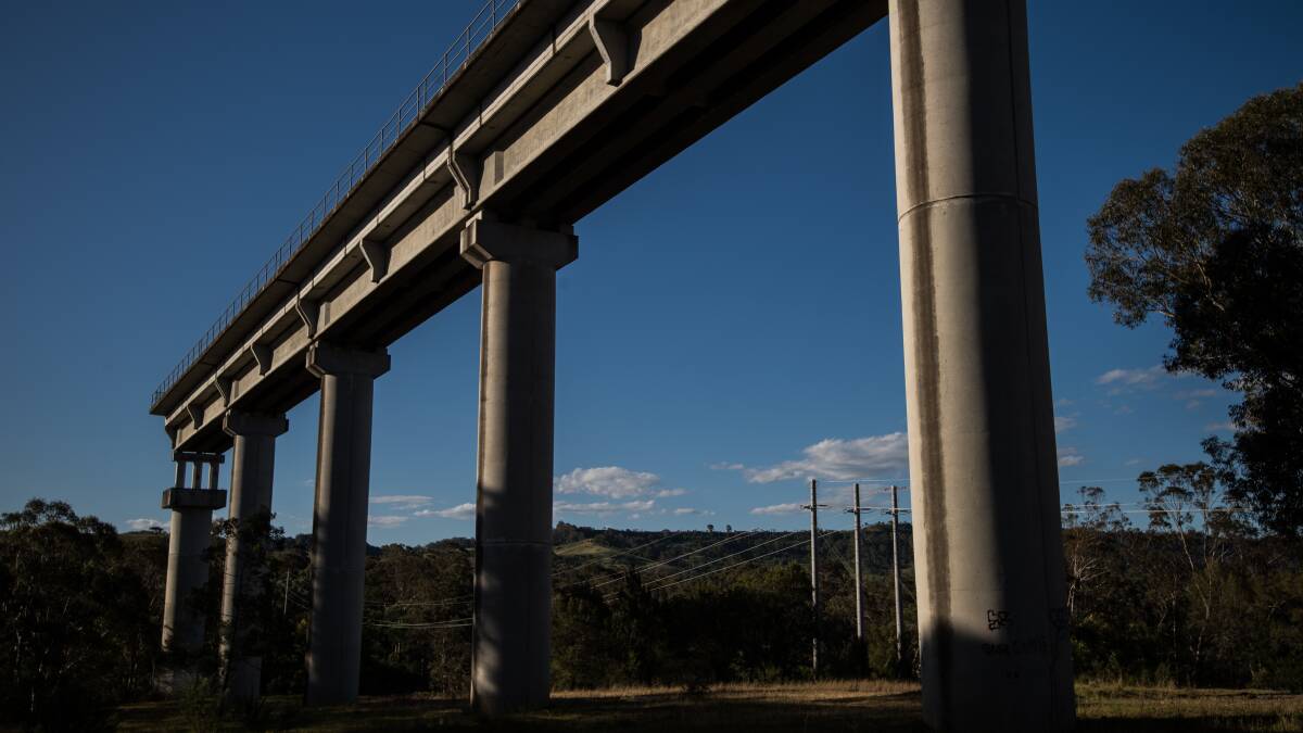 SUMMER HERALD. FORGOTTON SYDNEY. The Dombarton - Maldon rail bridge in Picton was abandoned mid construction in 1988. Photo: Wolter Peeters, The Sydney Morning Herald. 18th October 2016