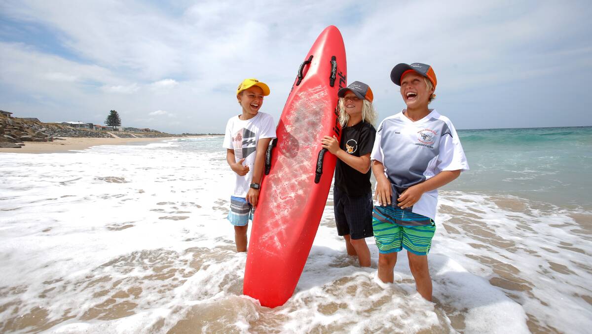 Little rescuers: Zane Hammersley, 10, Storm Balmain, 9 and Nash Balmain, 10, at Warilla beach where they helped save a grandmother and her three grandchildren - plus the family's Jack Russell dog. Picture: Adam McLean.