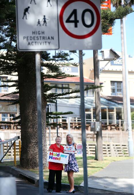 SAFETY SIGNS: Shellharbour Mayor Marianne Saliba and road safety officer Jenny Davies near one of the new safety signs. Picture: Sylvia Liber 