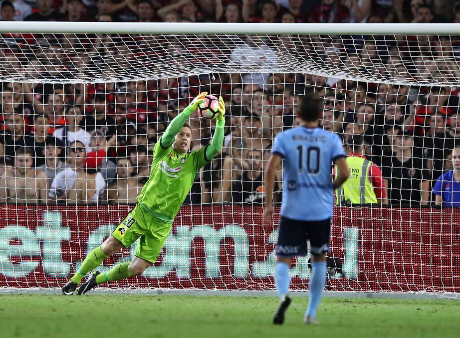 STOPPED: Sydney FC goalkeeper Danny Vukovic stops a Western Sydney shot in Saturday's A-League derby which ended in a nil-all draw. Picture: Cameron Spencer/Getty Images