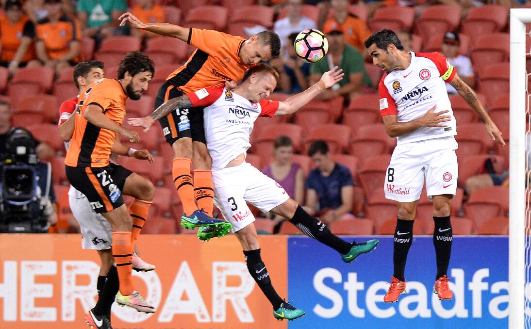 NEW INITIATIVE: Brisbane Roar's Jade North rises above Wanderer Jack Clisby. North will come to the Illawarra next week. Picture: GETTY IMAGES