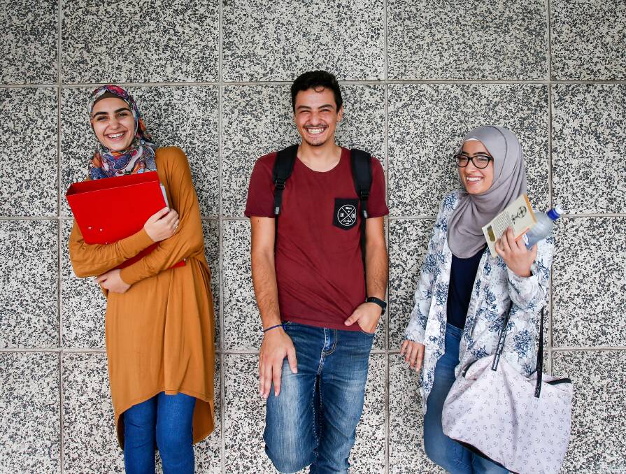 Back at school: Syrian students Khouloud Altinawi and Nasrin Auayoub from Cringila and Alaa Abouzamer from Wollongong came to Australia in 2014 and became friends at Five Islands Secondary College. Picture: Adam McLean.