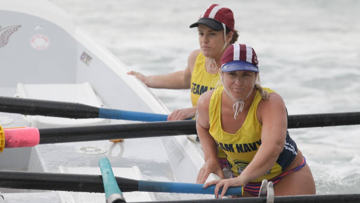 Pushing ahead: Members of Wollongong City reserve women's team during competition at the Australian Surf Rowing League event at Shellharbour on Saturday. 