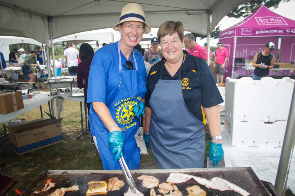Rotary members Debra Petreski and Robyn Fanning cooking up a storm at Breakfast on the Beach on Sunday. Picture: Georgia Matts