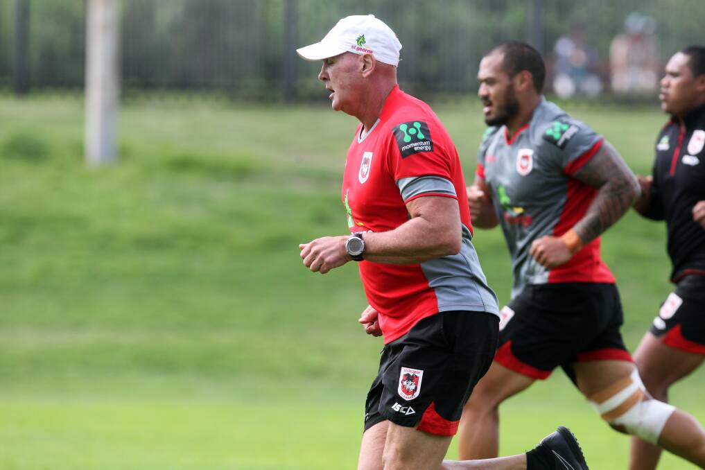 Long run: Paul McGregor takes to a fitness drill with the players at WIN Stadium this year. Picture: Sylvia Liber