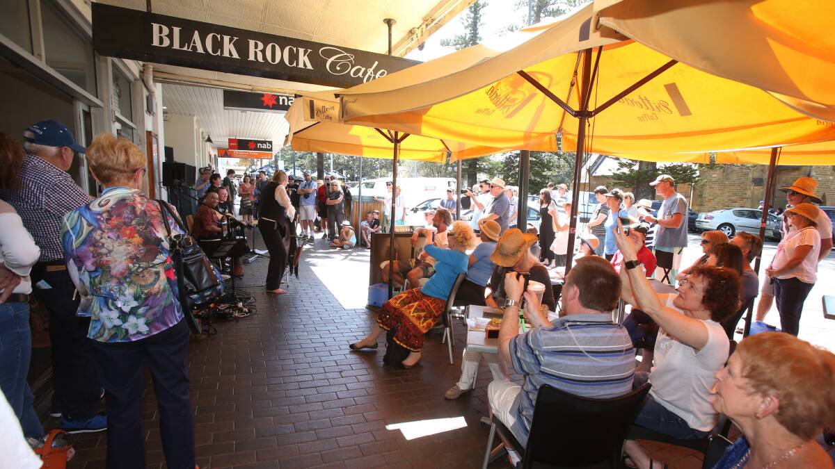 Crowd gather to watch Burton, Marsh and Toner entertaining the crowd in 2017 at Black Rock Cafe for the Kiama Jazz and Blues Festival. Picture: Robert Peet