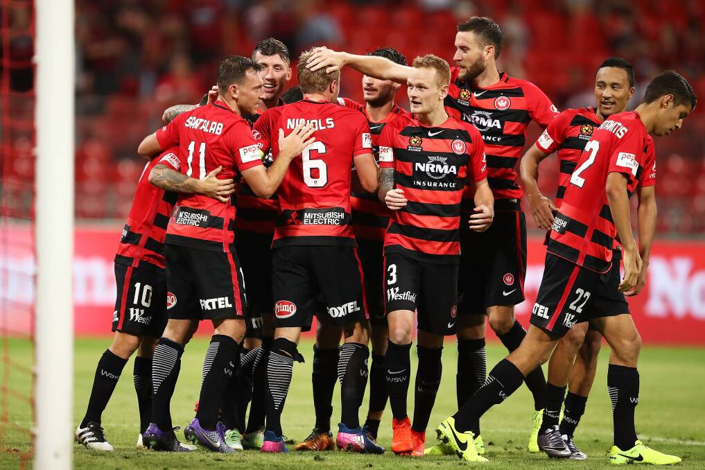 DOUBLE DELIGHT: Brendon Santalab (No.11) celebrates a goal with Western Sydney Wanderers teammates. 