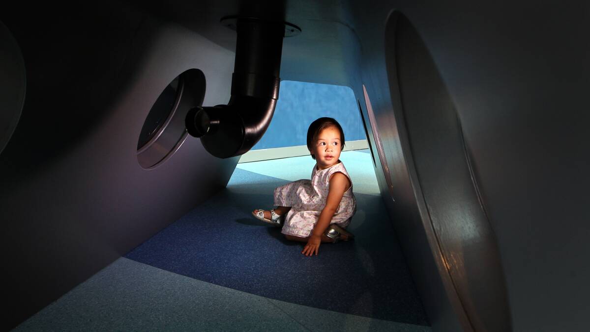Covering new ground: Aria Gross, 21 months, exploring the submarine at the Early Start Discovery Space's newest attraction, Crawlers' Beach. Picture: Sylvia Liber 