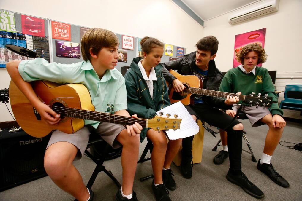 CREATIVE HOTHOUSE: Woonona High School students Riley Walker, Caitlyn Davies, and Ethan Johnson with Thirsty Merc singer and SongMakers' mentor Rai Thistlethwayte. Picture: Adam McLean