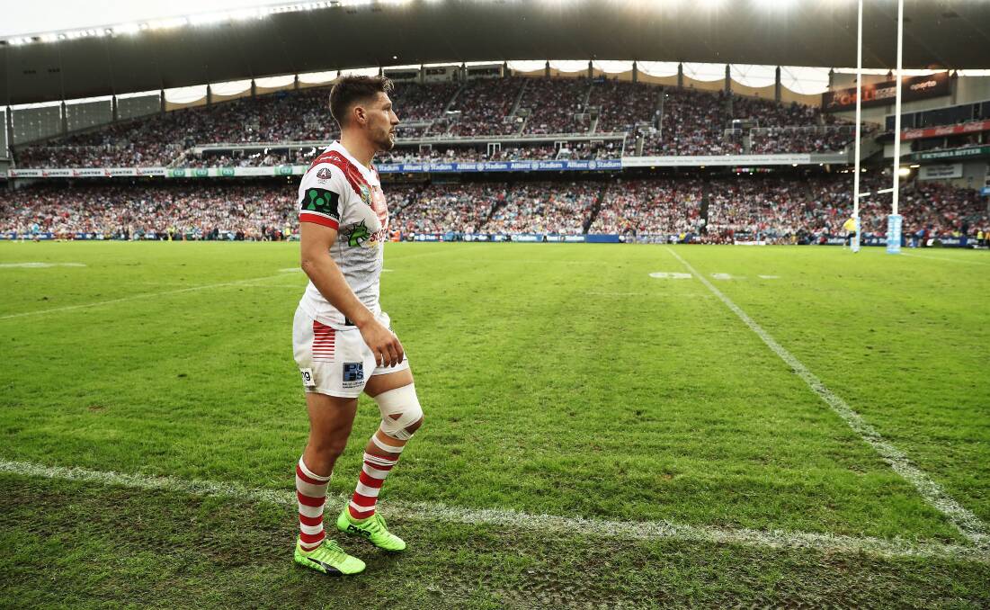 Time out: Gareth Widdop limps along the sideline on Anzac Day. Picture: Ryan Pierse/Getty Images