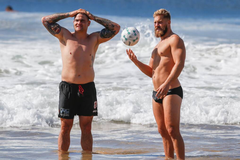 MR FIXIT: Jack de Belin and Russell Packer enjoy the Dragons recovery session at North Wollongong Beach on Wednesday. Picture: Adam McLean