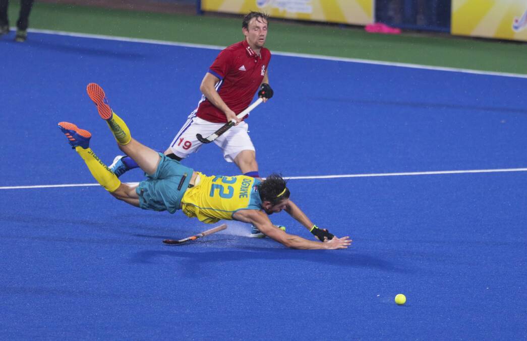 Tumble: Australia's Flynn Ogilvie during the Azlan Shah tournament, where he suffered a hamstring injury which kept him out for six months. Picture: AP Photo