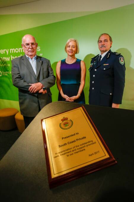 Plaque presentation: Phil Koperberg, South Coast Private general manager Kim Capp and NSW RFS Assistant Commissioner Stewart Midgley on Tuesday. Picture: Adam McLean