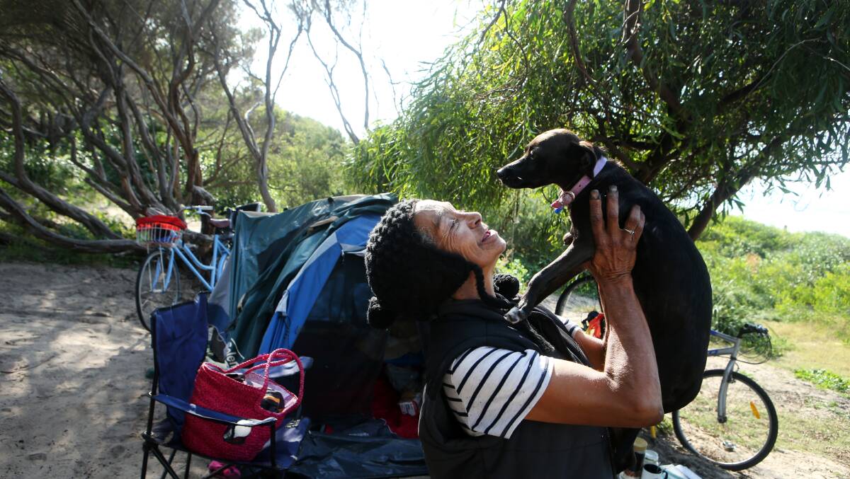 FLASHBACK: Homeless woman Wendy Lawrence is reunited with her beloved companion Lou-Lou, a Jack Russell-cross, in May. Picture: Sylvia Liber