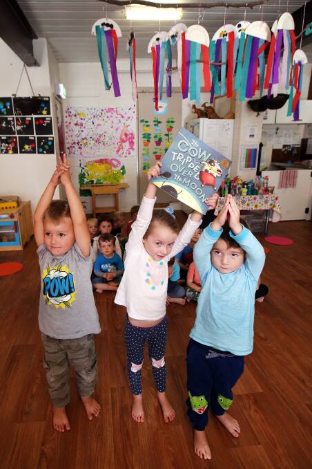 YOGA TIME: Kindy Korner preschoolers Patrick, Sienna and Izaac did yoga as part of National Simultaneous Storytime on Wednesday. Picture: Sylvia Liber
