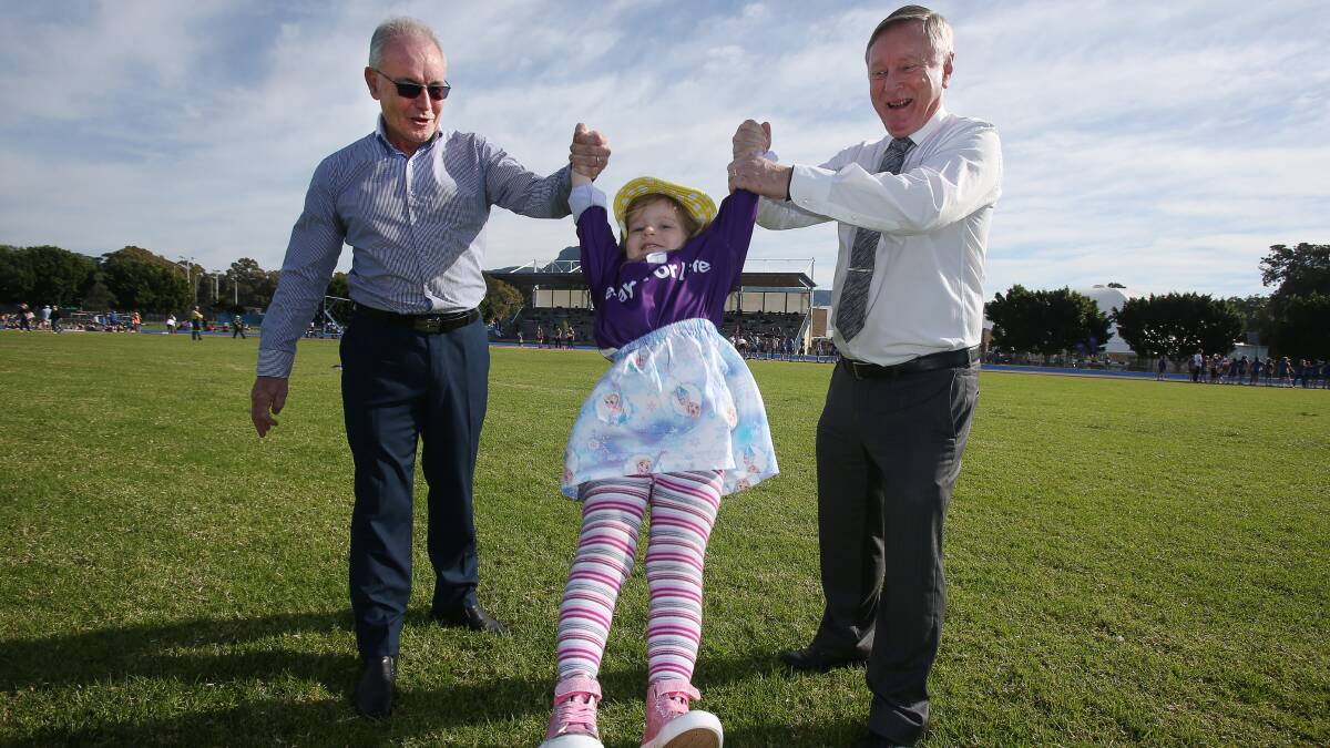 Launch: Wollongong Relay for Life chairman Stuart Barnes, participant Avah Bower and patron, newsreader Geoff Phillips, at Beaton Park to launch the 2017 event. Little Avah has taken part with her mother Tehla, a former Cancer Council employee, since she was five months old to support the cause. Picture: Robert Peet