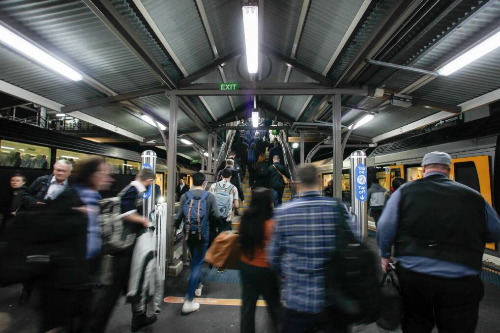 Home at last: Commuters disembark after the 7:02 arrives at Thirroul station on Wednesday. Picture: Adam McLean