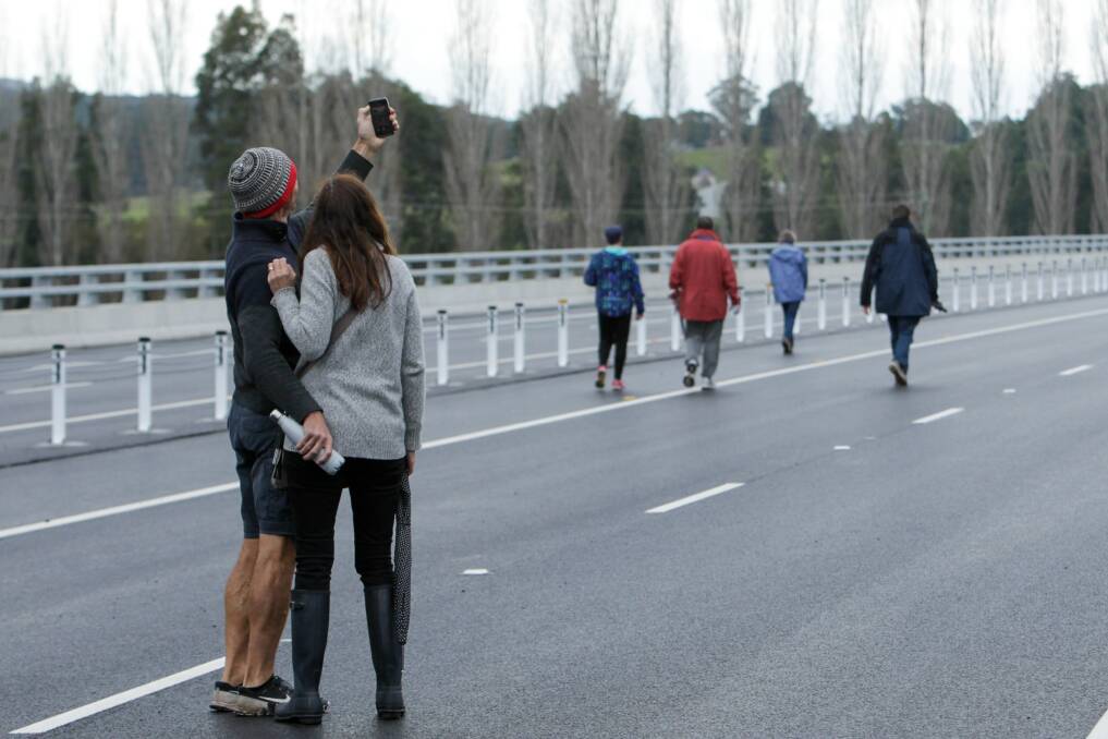 People walk along the Berry bypass on its opening day ... South Coast MPs want the the federal government to chip in to upgrade future sections of the Princes Highway. Picture: Adam McLean