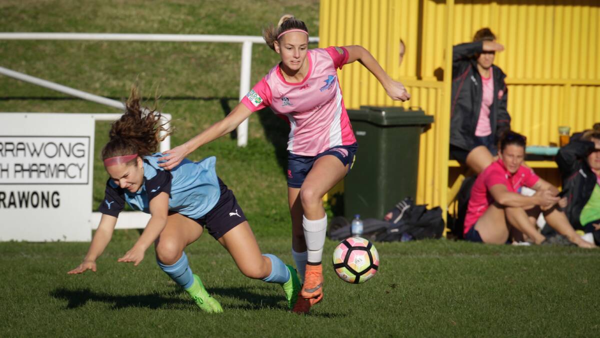 CHALLENGE: Illawarra's Blaize Kendis battles for possession against Football NSW Institute at JJ Kelly Park. Picture: GEORGIA MATTS