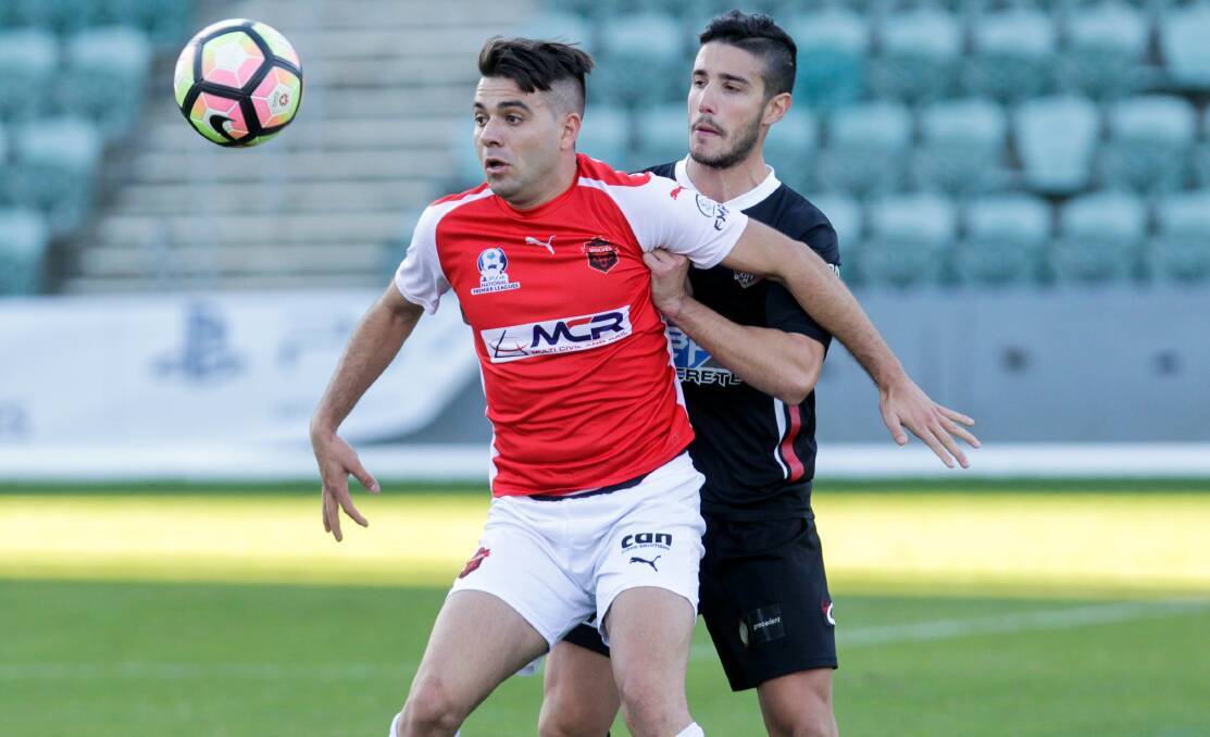 EYE ON THE BALL: Wollongong Wolves striker Peter Simonoski battles for possession in a match against Blacktown City at WIN Stadium. Picture: ADAM McLEAN