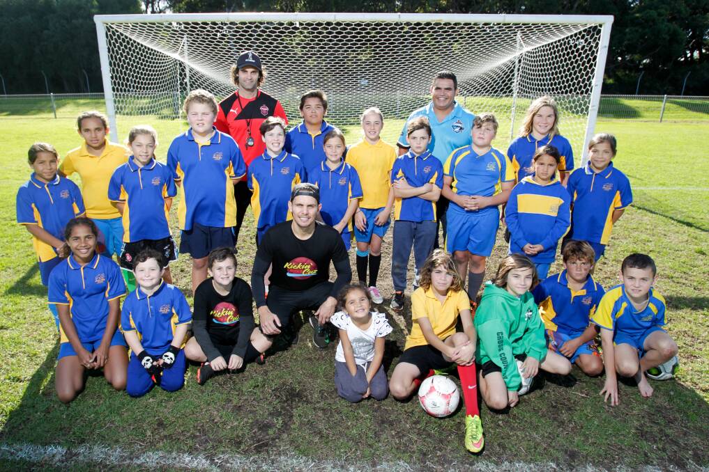 INITIATIVE: Roar defender Jade North with kids from Jervis Bay school taking part in the 'Kickin' with a Cuz' football clinic. Picture: ADAM McLEAN