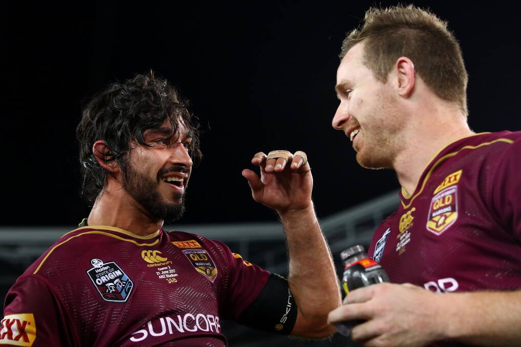 Did it again: Johnathan Thurston and Michael Morgan. Picture: Mark Kolbe/Getty Images