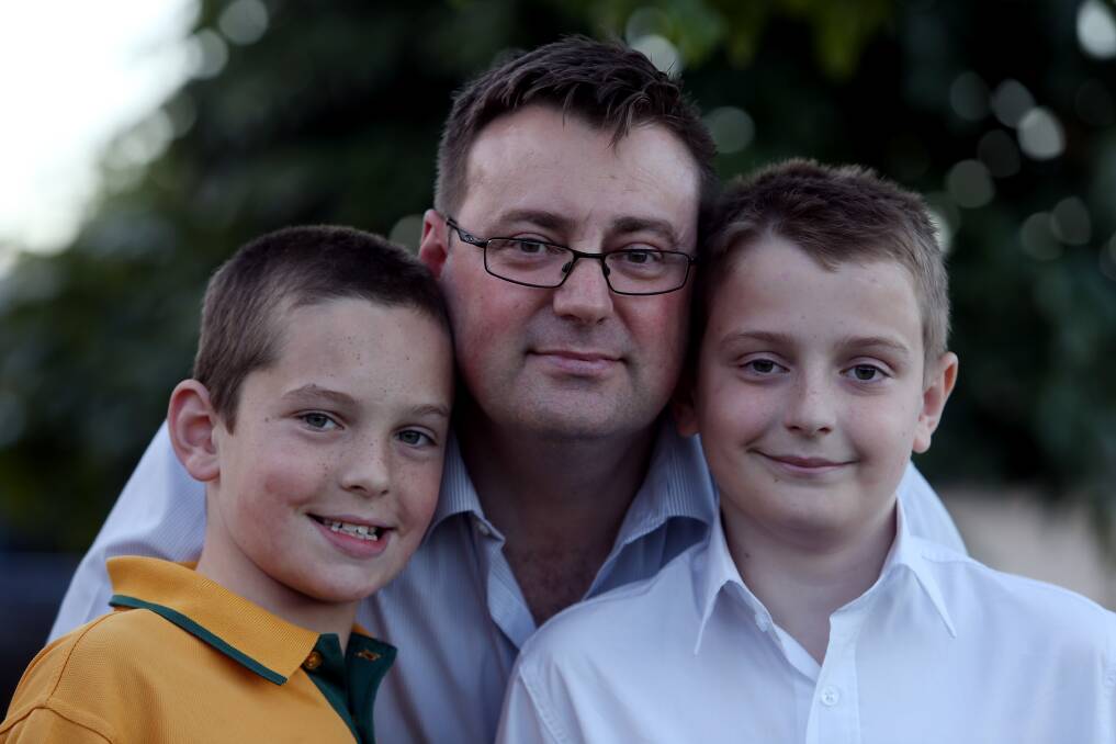 NOT HAPPY: Wollongong man Rueben Sakey with his sons Baxter, 10 and Harrison, 11. Mr Sakey disagrees with Pauline Hanson's comments saying autism kids should be segregated from mainstream classes. Picture: Robert Peet