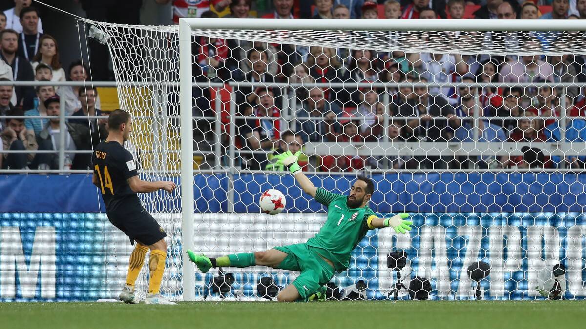 Beaten: James Troisi of Australi scores against Claudio Bravo of Chile during the FIFA Confederations Cup. Picture: Francois Nel/Getty Images