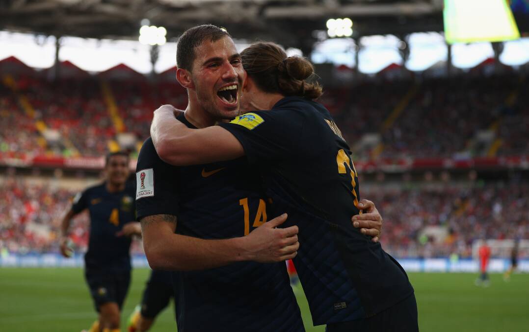 Found the net: James Troisi of Australia celebrates scoring his sides first goal with Jackson Irvine of Australia during the FIFA Confederations Cup game against Chile. Picture: Ian Walton/Getty Images
