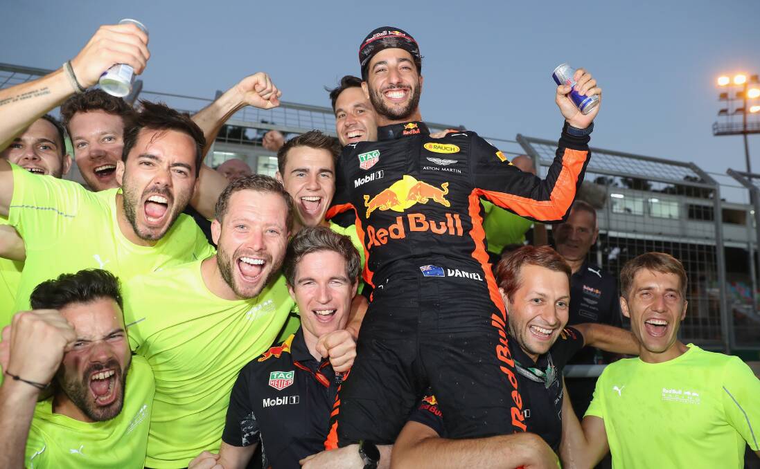Cheers: Daniel Ricciardo of Australia and Red Bull Racing celebrates his win with his team. Picture: Mark Thompson/Getty Images