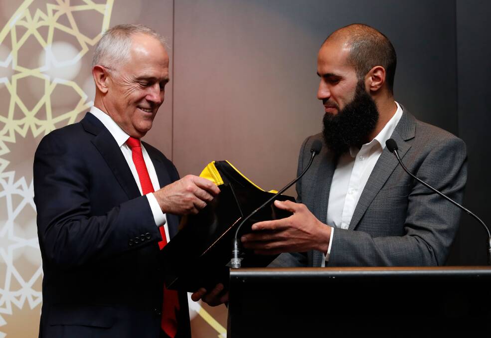 Support: Malcolm Turnbull, Prime Minister of Australia chats to Bachar Houli. Picture: Adam Trafford/AFL Media/Getty Images