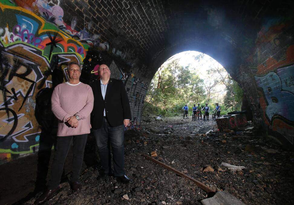 Wollongong councillor Leigh Colacino and Heathcote MP Lee Evans at the Otford rail tunnel, which will become a shared walkway. Picture: Robert Peet