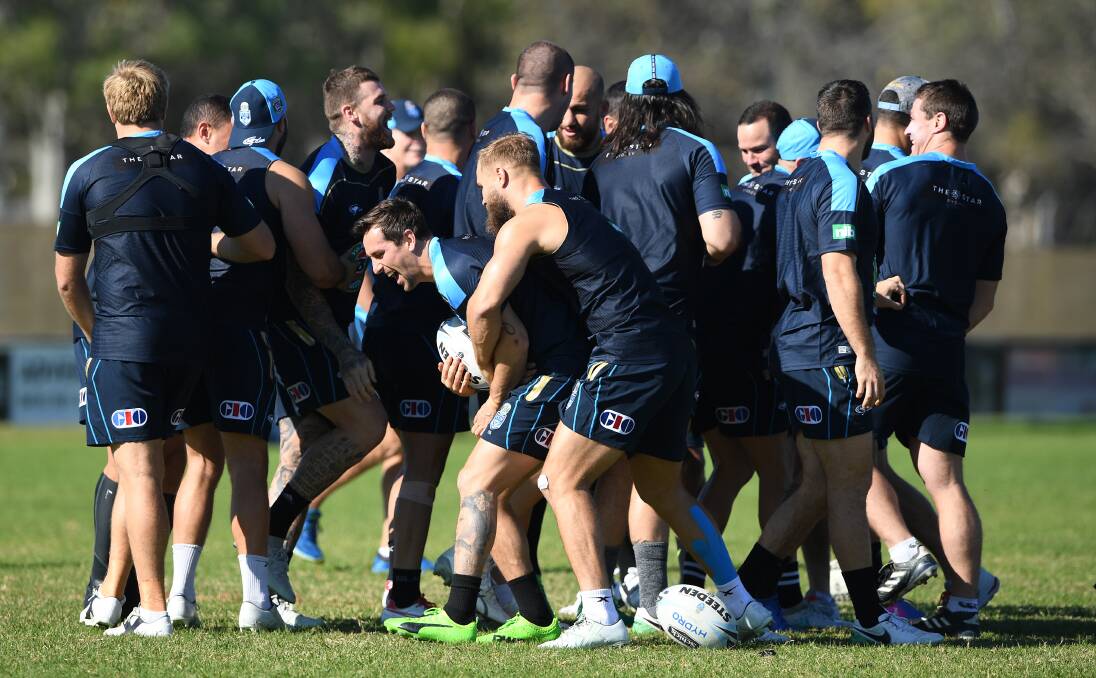 Blue rinse: Mitchell Pearce and Jack De Belin (front) during NSW Blues State of Origin camp at Kingscliff. Picture: AAP Image/Dave Hunt