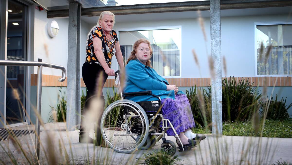 Far from home: Oak Flats resident Linda Damiani - pictured with sister Susan Abbot - is devastated that despite having private health cover she cannot recuperate at a private hospital close to her home. Picture: Sylvia Liber