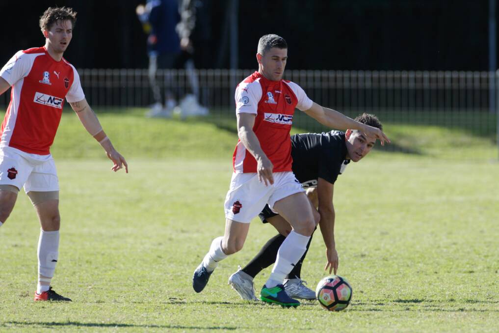 BATTLE: Wollongong Wolves gun Nick Montgomery will be in midfield when they take on Bonnyrigg White Eagles. Picture: GEORGIA MATTS