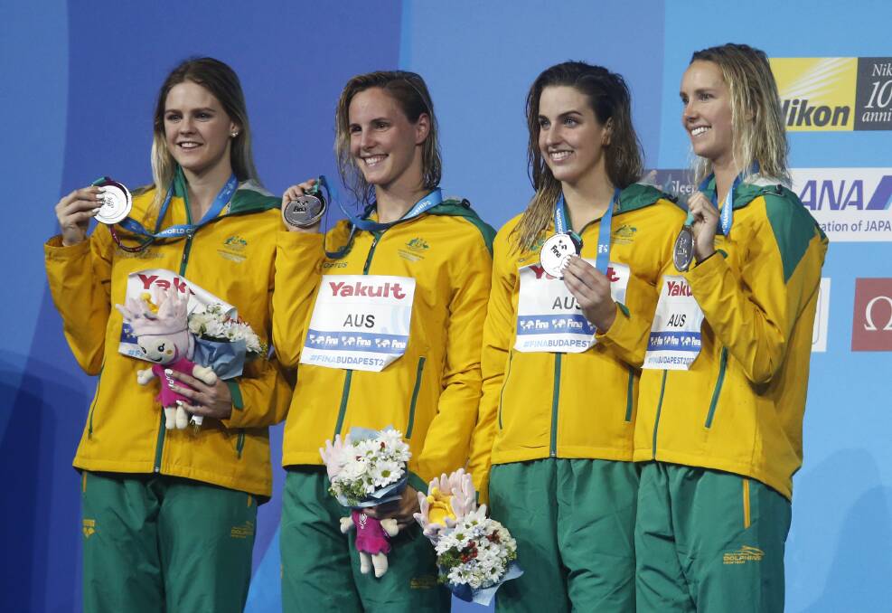 SILVER: Shayna Jack, Bronte Campbell, Brittany Elmslie and Emma McKeon show off their medal after the women's 4x100-meter freestyle final during the swimming competitions of the World Aquatics Championships in Budapest. Picture: AP PHOTO
