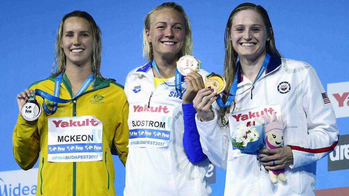 Silver bullet: Emma McKeon of Australia, gold medal winner Sarah Sjostrom of Sweden and bronze medal winner Keli Worrell. Picture: Tamas Kovacs/MTI via AP