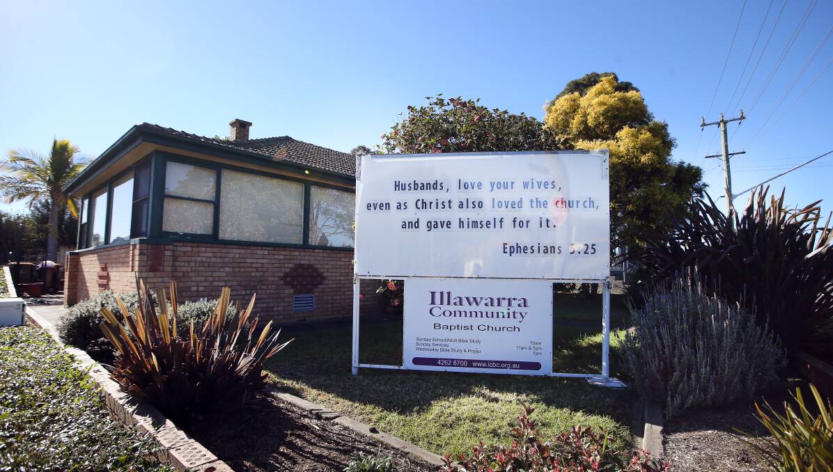 Marital advice: On Tuesday a sign at the church's adjoining residence quoted a verse from the Bible 'Husbands, love your wives'. Picture: Sylvia Liber