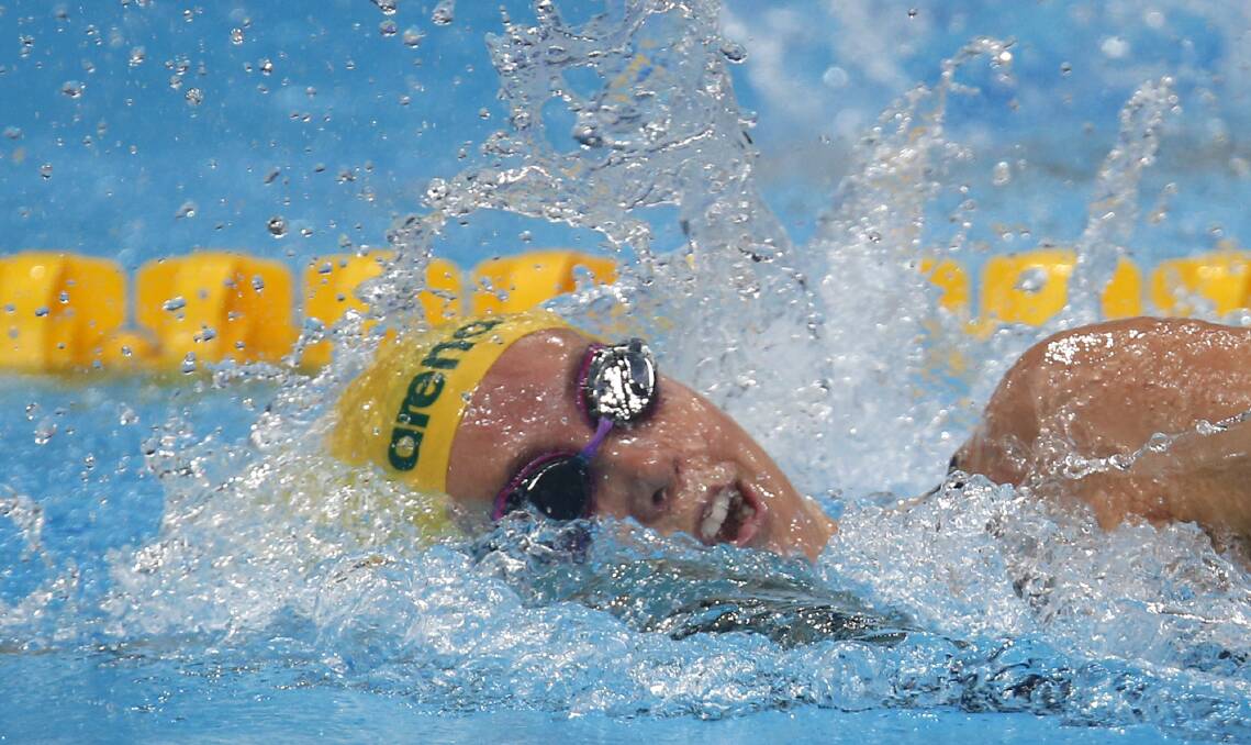 Big splash: Australia's Emma McKeon competes in a women's 200-metre freestyle heat during. Picture: AP Photo/Darko Bandic