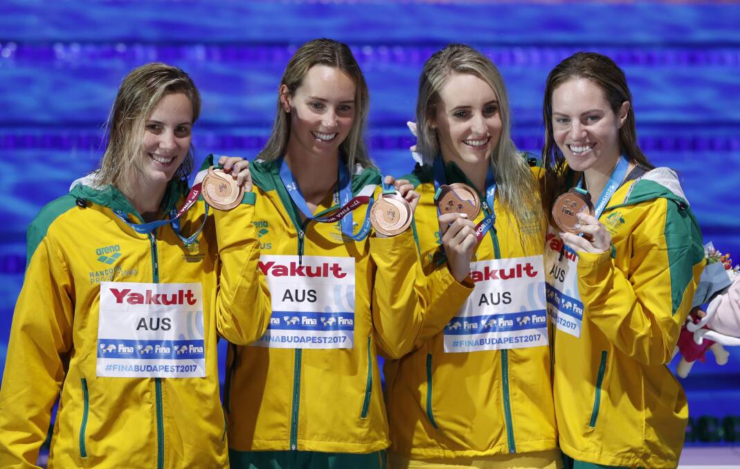 SHINING LIGHT: Emma McKeon (second from left) claimed her sixth medal on the final day of the Swimming World Championships in Budapest. Picture: AP