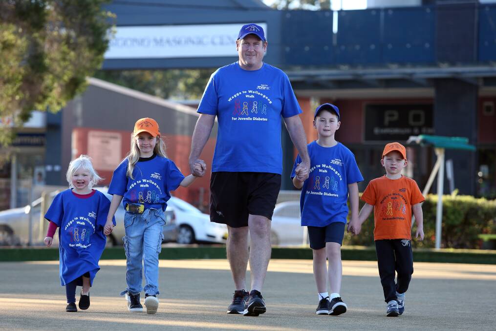 Fundraiser: Luke Mayberry with Lexie Martin, Madeleine Saywell, Zane Mayberry and Aidan Martin at Wiseman's Park Bowling Club where a family fun day will be held on October 14 at the end of his walk. Picture: Robert Peet
